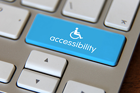 Keyboard with an accessibility utilizing the international wheelchair symbol in place of the enter key.