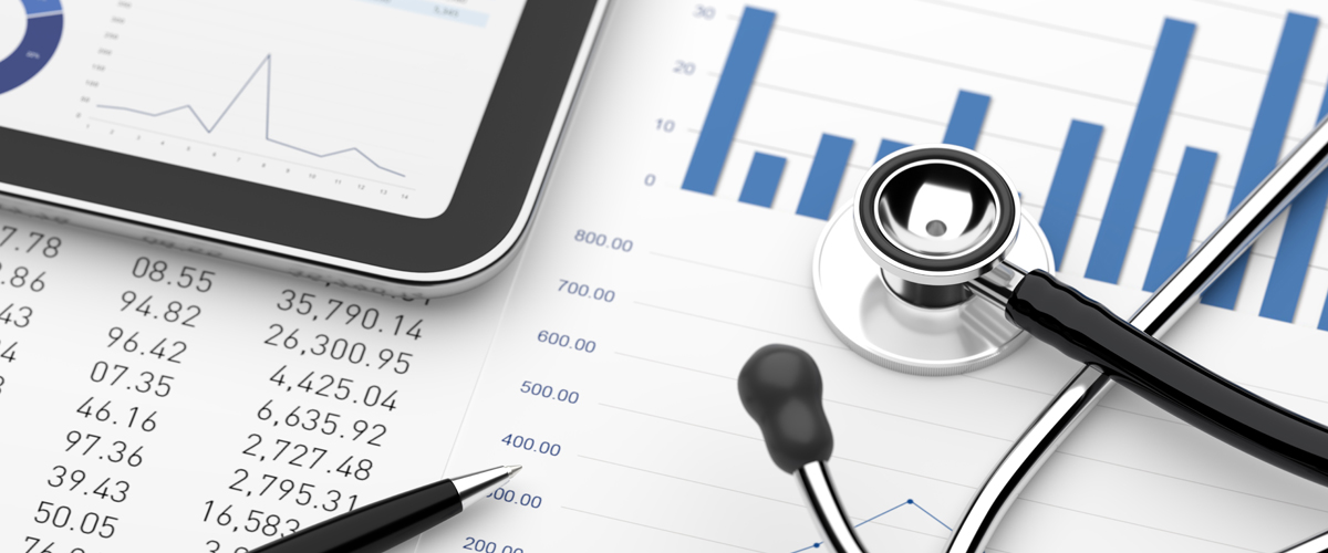 Picture with graphs, a stethoscope and a tablet. This is an illustration to represent healthcare payments