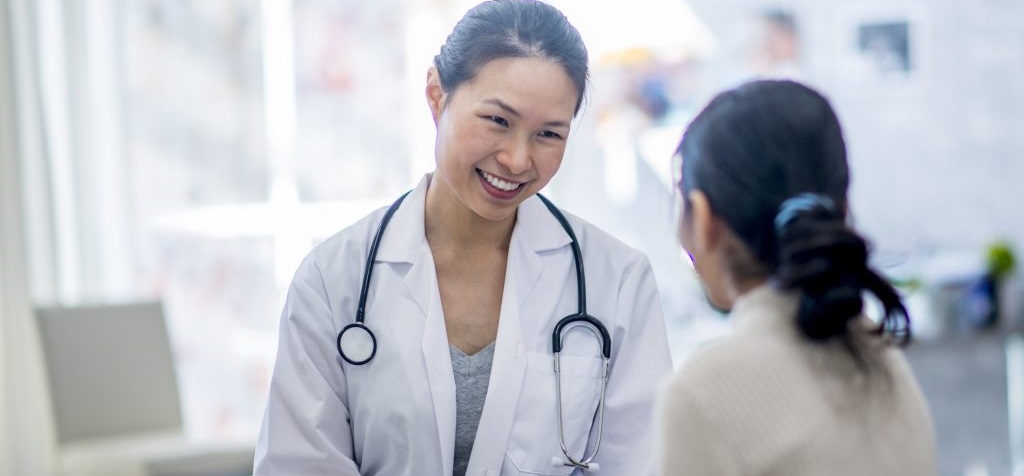 Dr. Small happily conversing with a patient