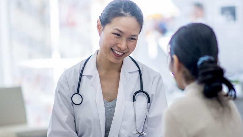 Dr. Small happily conversing with a patient